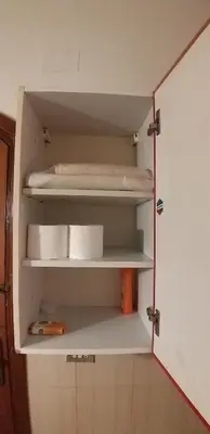 a cupboard with shelves in a room at Downtown ElGouna Excellent Location in Hurghada