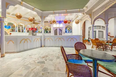 a dining room with a table and chairs at The Grand Hotel, Hurghada in Hurghada