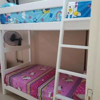 a bedroom with two bunk beds with a crib at Sweet Home Hostel- ممنوع للمصريين open 24 hour in Hurghada