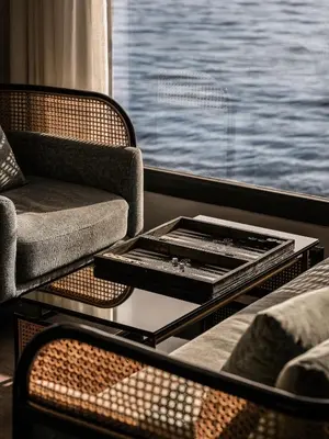 a room with a table and chairs and a window at Historia The Boutique Hotel Nile Cruise - Every Monday from Luxor for 04 & 07 Nights - Every Friday From Aswan for 03 & 07 Nights in Luxor