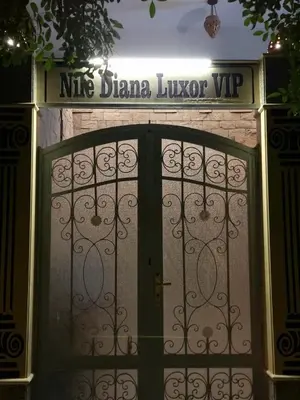 a door to a house with a sign above it at Nile diana luxor in Luxor