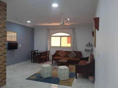 a living room with a couch and a table at German Dolphin in Quseir