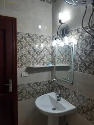 a bathroom with a sink and a mirror at German Dolphin in Quseir