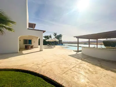 a backyard of a house with a swimming pool at Luxury 4 bedroom villa with a heated pool in Hurghada