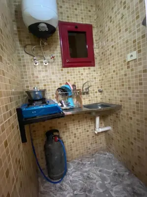 a bathroom with a sink and a fire hydrant at ALRahman Building in Aswan