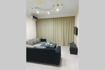 a living room with a couch and a table at sheraton blaza 101 in Hurghada