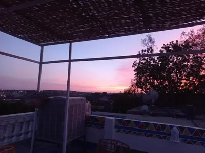 a view of the sunset from the balcony of a house at Private House with Garden and terrace in Aswan in Aswan