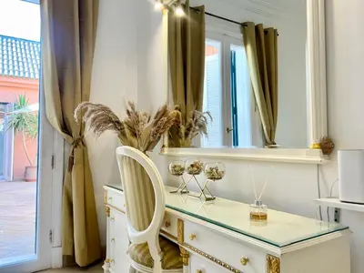 a dressing table with a mirror and a chair at Hill Villa Venezia El Gouna: pool, beach & WiFi in Hurghada