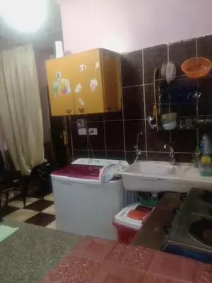 a small kitchen with a sink and a toilet at App11- BELAL - Enjoy the privacy of staying in a quiet apartment with free Wi-Fi as your complete second home in the heart of Hurghada in Hurghada