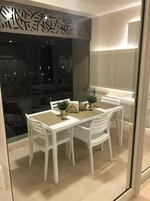 a white dining table and chairs in a room at Jutta Deluxe 2,5-Bedroom-Apartment Mangroovy-M10 El Gouna in Hurghada