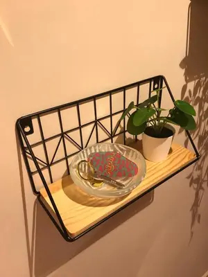 a shelf with a plate and a plant on it at Jutta Deluxe 2,5-Bedroom-Apartment Mangroovy-M10 El Gouna in Hurghada