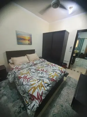 a bedroom with a bed with a colorful comforter at Abeer suites 2 in Hurghada