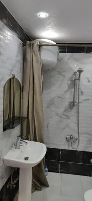 a bathroom with a sink and a shower at 2bedroom apartment in Summer Land Beach Resort in Hurghada