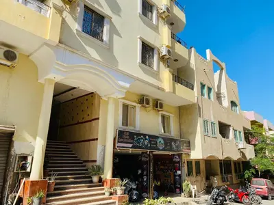 a large building with stairs leading up to it at RITA HOUSE SEA VIEW. Hurghada center in Hurghada