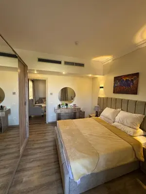 a bedroom with a large bed in a room at Apartment with private Beach in Sahl Hasheesh in Hurghada