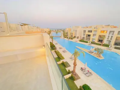 a view of a pool from the balcony of a hotel at Mangrovy 2 BR Gouna in Hurghada