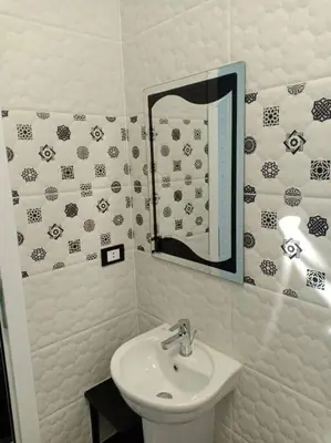 a bathroom with a sink and a mirror at Oasis resort-Nice Condo -B31-Al Ahyaa - Hurghada in Hurghada