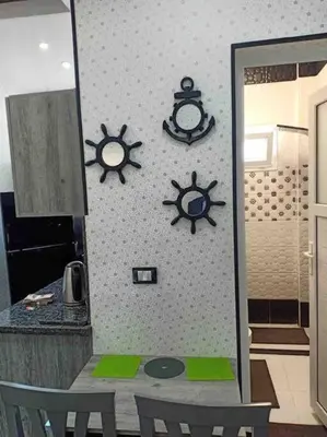 a kitchen with a table with a mirror and a sink at Oasis resort-Nice Condo -B31-Al Ahyaa - Hurghada in Hurghada