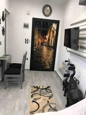 a living room with a dog sitting in front of a door at Oasis resort-Nice Condo -B31-Al Ahyaa - Hurghada in Hurghada