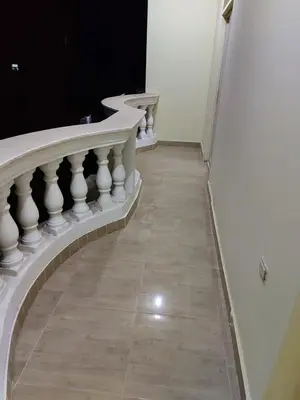 a stairway with white railings and a tile floor at STAR HOME HURGHADA ARABIA in Hurghada