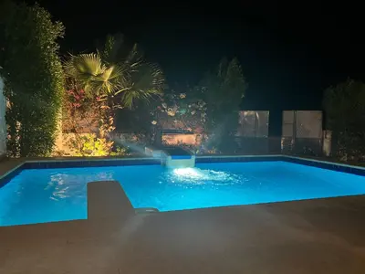 a swimming pool in a yard at night at Villa KUBA luxury private pool Hurghada in Hurghada