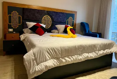 a bed with a yellow duck on top of it at Villa KUBA luxury private pool Hurghada in Hurghada