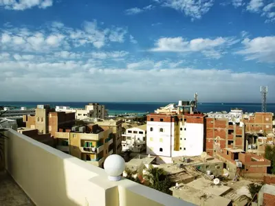 a view of a city from a building at Luxor Hotel Hurghada in Hurghada