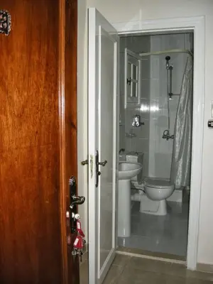 a bathroom with a toilet and a sink at Luxor Hotel Hurghada in Hurghada