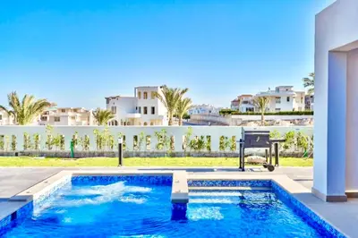 a swimming pool in the backyard of a house at Hurghada Sahl Hasheesh sea-view Villa with private pool in Hurghada