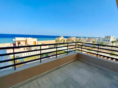 a balcony with a view of the beach at Hurghada Sahl Hasheesh sea-view Villa with private pool in Hurghada