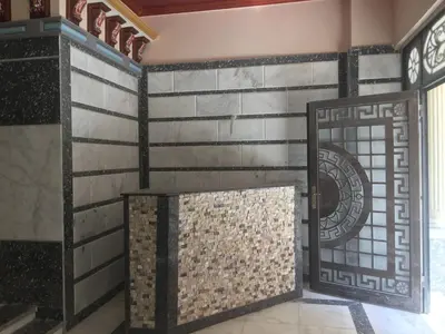 a room with a wall of tiles and a door at Studio pool view next to the Marina,Sheraton Plaza 320 in Hurghada