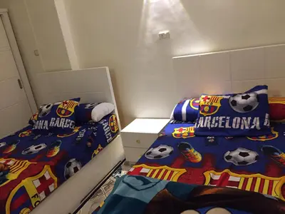 a bedroom with two beds with soccer balls on them at Babylon guesthouse in Aswan