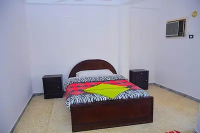 a bedroom with a bed in a room at Rose Guest House \u60a8\u5728\u76e7\u514b\u7d22\u7684\u7b2c\u4e8c\u500b\u5bb6 in Luxor