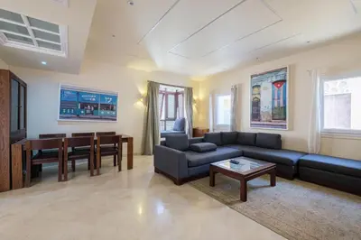 a living room with a couch and a table at El Gouna abo tig marina 1 bedroom apartment and 1 bedroom at the Roof in Hurghada