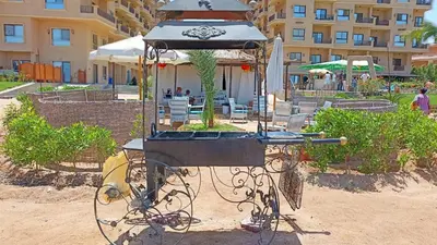 a bird feeder in front of a building at Tertels beach resort hurghada F 2-6 in Hurghada