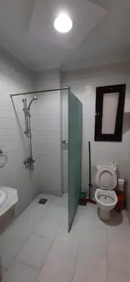 a bathroom with a toilet and a shower and a sink at Tertels beach resort hurghada F 2-6 in Hurghada