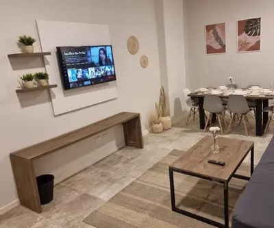 a living room with a tv on the wall at Boho Homes in Hurghada