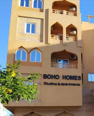 a building with a boalo homes sign on it at Boho Homes in Hurghada