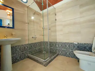 a bathroom with a shower and a sink at Amaros Sahl Hasheesh sea view Villa with Pool سهل حشيش in Hurghada