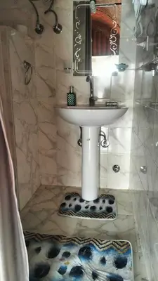 a bathroom with a sink and a mirror at Go Inn Backpackers in Aswan