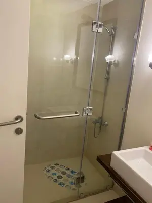 a shower with a glass door next to a sink at A studio in Veranda Sahl Hasheesh in Hurghada