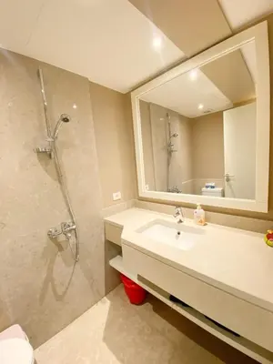 a bathroom with a sink and a shower at Minimal & Central 1BDR Apt Abu Tig Marina in Hurghada
