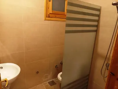 a bathroom with a sink and a toilet at Embrace Guest House in Luxor