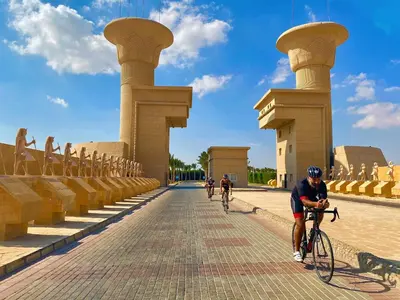 a group of people riding bikes down a street at JWE Residence - Quality experience near Red Sea in Hurghada