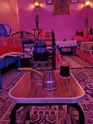 a kitchen with a tea kettle on a table in a room at Miral Nubian House in Aswan