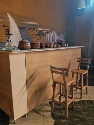 two chairs sitting at a counter in a room at Miral Nubian House in Aswan