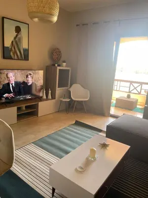 a living room with a couch and a table at Babel Apartments Hotel El Gouna in Hurghada