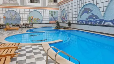 a large swimming pool with a tile wall at sheraton blaza307 in Hurghada