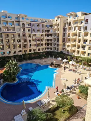 an overhead view of a swimming pool in a resort at Florenza Blue Sky & Poolview Studio Hurghada in Hurghada