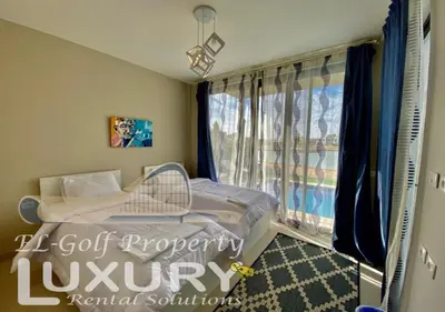 a small bedroom with a bed and a window at Tawila Villa T1-15 in Hurghada